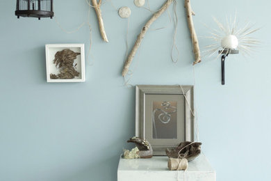 Inspiration for a coastal living room remodel in Portland with blue walls