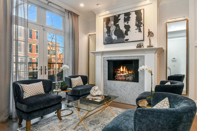 Example of a transitional medium tone wood floor and brown floor living room design in Chicago with white walls and a standard fireplace