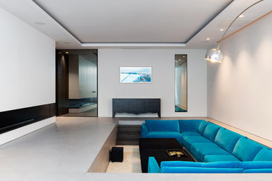 Design ideas for a large contemporary open concept home theatre in London.