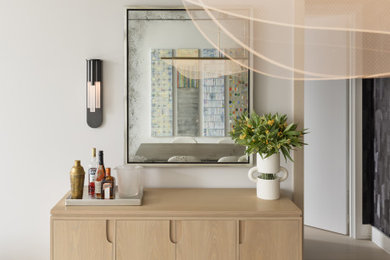 Mid-sized trendy light wood floor and brown floor great room photo in New York with no fireplace and gray walls