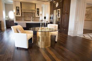 Mid-sized ornate dark wood floor and brown floor kitchen/dining room combo photo in Vancouver with white walls