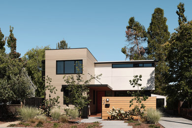 Inspiration for a modern beige two-story mixed siding exterior home remodel in San Francisco