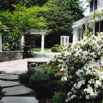 Flagstone Patio with White Arbor, Pergola and Azaleas