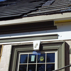 Tile roof installation under construction - Roofing And Gutters