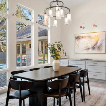 Light-filled dining space with sputnik chandelier and indoor-outdoor views