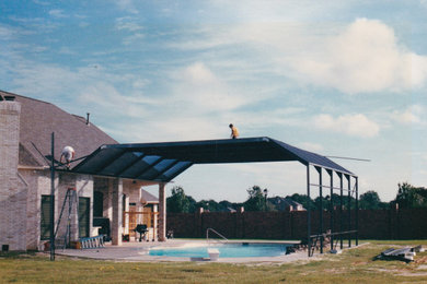 Pool - large custom-shaped pool idea in Houston