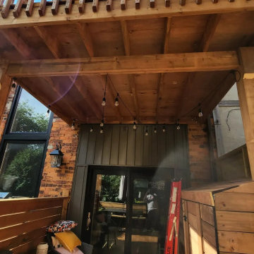 Upper deck and railing seen from the covered lower deck in North York