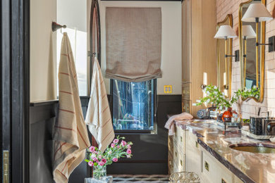 Bathroom - large eclectic master pink tile marble floor, multicolored floor, double-sink and wainscoting bathroom idea in Houston with shaker cabinets, light wood cabinets, white walls, an undermount sink, marble countertops, a hinged shower door and a built-in vanity