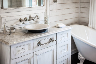 Inspiration for a small shabby-chic style master black tile and porcelain tile porcelain tile freestanding bathtub remodel in Charlotte with flat-panel cabinets, white cabinets, a two-piece toilet, white walls, a vessel sink and marble countertops