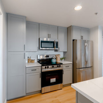 Modern Gray Shaker Kitchen Cabinets with Stainless Steel Appliances The Cabinati