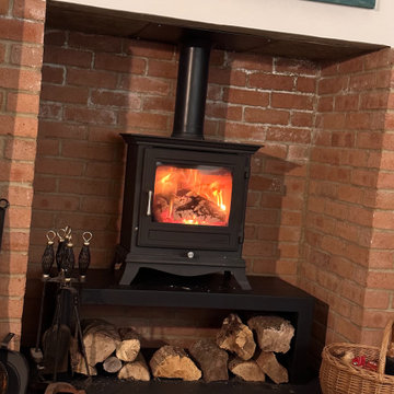 Wood-Burning Stove Featuring Bench & Log Store