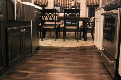 Trendy laminate floor eat-in kitchen photo in Cleveland