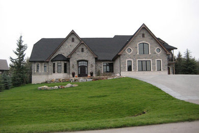 Example of a classic exterior home design in Calgary