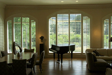 Inspiration for a timeless medium tone wood floor and brown floor great room remodel in Boise with yellow walls