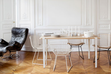 Inspiration for a contemporary dining room in Paris with white walls.