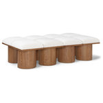 Meridian Furniture - Pavilion Black Boucle Fabric Bench, Cream, Walnut Brown Finish, 62" W X 36" D X 17.5" H - Bring valuable seating and remarkable style to your space with this cream Pavilion boucle fabric bench, an exquisite balance of style and usability for the entryway, bedroom, and beyond. Crafted from oak veneer with a walnut brown finish, this bench has a 4-inch-thick seat cushion that's channel-tufted for a touch of luxury. The bench's columnar bases add a dash of art deco design, making it a captivating focal point in any room.
