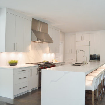 Transitional White Kitchen with Large Island and Dining Room