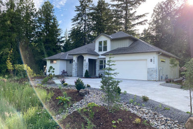 Inspiration for a large transitional gray two-story concrete fiberboard and clapboard house exterior remodel in Portland with a hip roof, a shingle roof and a gray roof