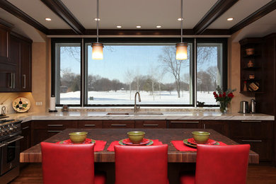 Kitchen - transitional medium tone wood floor kitchen idea in Chicago with an undermount sink, shaker cabinets, dark wood cabinets, wood countertops, multicolored backsplash, ceramic backsplash and stainless steel appliances