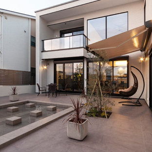 他の地域のアジアンスタイルのおしゃれな中庭のテラス (日よけなし) の写真