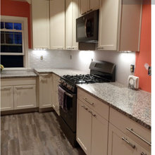 white kitchens with bright, orange, or red walls