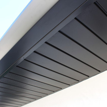 Soffits, Fascia, and Angle Face Gutters in Dark Bronze Aluminum. Long Beach