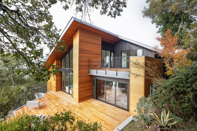 Two-story wood house exterior idea in Other
