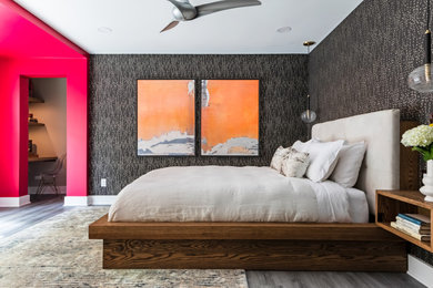 Bedroom - mid-sized modern master laminate floor, gray floor and wallpaper bedroom idea in Raleigh with multicolored walls