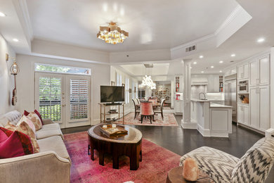 Inspiration for a mid-sized eclectic open concept dark wood floor and black floor family room remodel in Atlanta with white walls and a tv stand