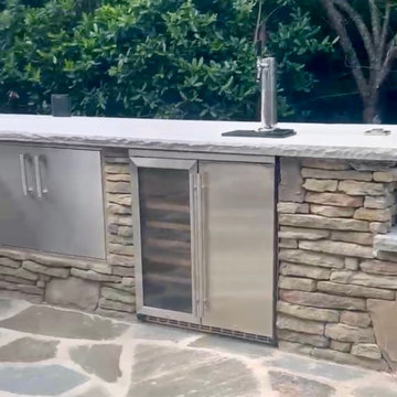 Outdoor Kitchen with Fire Feature & Beer Tap and Flagstone Patio