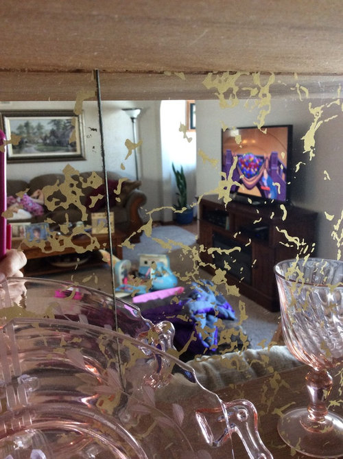 Tiled mirrors stuck on dry wall