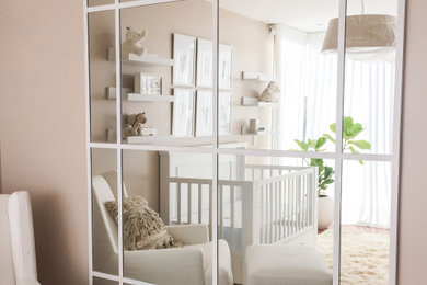 Design ideas for a small vintage gender neutral nursery in Other with beige walls, dark hardwood flooring and brown floors.