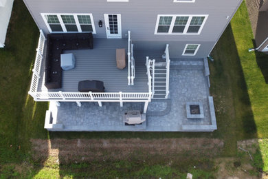 Example of a mid-sized backyard patio design in Baltimore with decking
