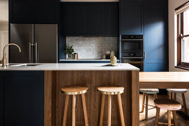 This is an example of a transitional kitchen in Melbourne.