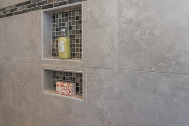 Design ideas for a transitional bathroom in Raleigh with gray tile and porcelain tile.