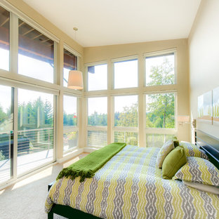 Inspiration for a contemporary bedroom in Seattle with beige walls, carpet and no fireplace.
