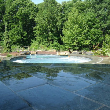 Delaware Township custom pool and raised spa with negative edge & water feature