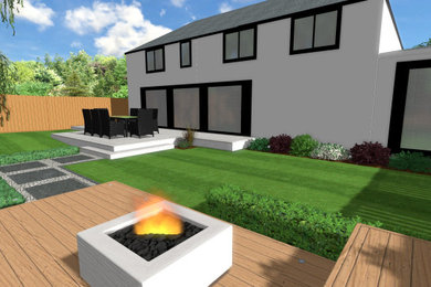 Photo of a medium sized contemporary back formal partial sun garden for summer in West Midlands with a fire feature, decking and a wood fence.
