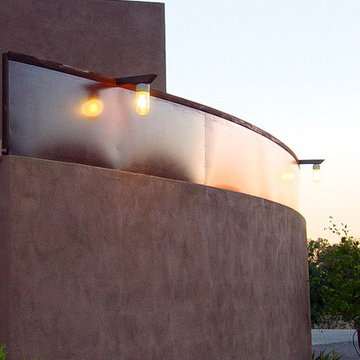 masonry and patines steel protect the entry courtyard space as culde sac is only
