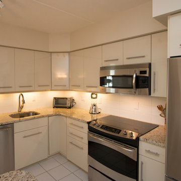 White Contemporary Kitchen with Brushed Nickel Hardware and Granite in Falls Chu