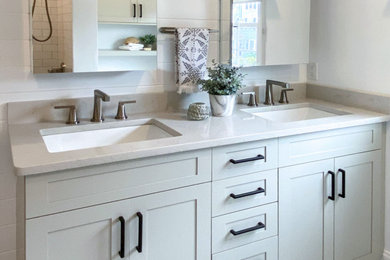 Example of a transitional master white tile and subway tile porcelain tile, gray floor and double-sink bathroom design in Boston with shaker cabinets, gray cabinets, a bidet, white walls, an undermount sink, quartz countertops, gray countertops and a built-in vanity
