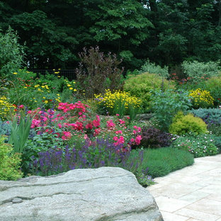 Mid-sized traditional backyard full sun garden in New York with concrete pavers for spring.