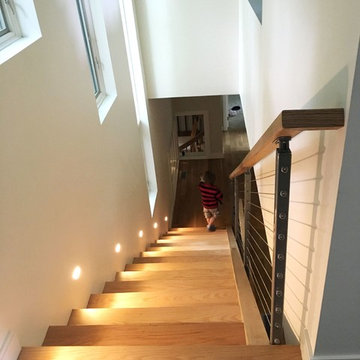 Open-riser stair from upper level Kitchen to bedrooms.