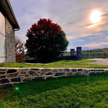 Restoration and tuckpointing of a 1778 stone barn.