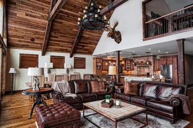 Living room - rustic open concept living room idea in Burlington with white walls