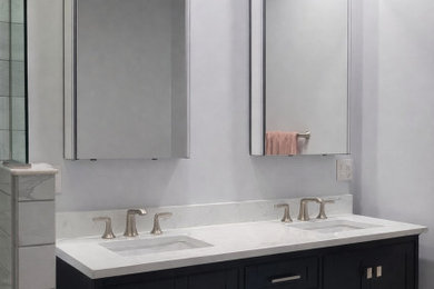 Bathroom - mid-sized modern master gray tile and porcelain tile ceramic tile, gray floor and double-sink bathroom idea in Baltimore with shaker cabinets, blue cabinets, a two-piece toilet, gray walls, quartzite countertops, a hinged shower door, white countertops and a freestanding vanity