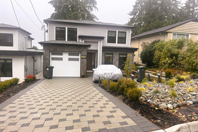 Example of a mid-sized transitional three-story exterior home design in Vancouver