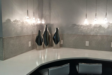 Inspiration for a mid-sized contemporary l-shaped seated home bar remodel in Austin with gray backsplash