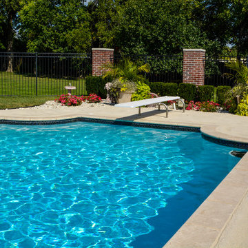 Grecian swimming pool with L, diving board and hot tub