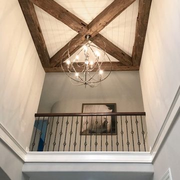 Weathered Antique Timbers across Vaulted Ceiling in a Contemporary Home